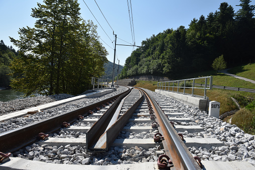 Mel, Norway – August 10, 2022: A beautiful shot of a railway leading to a ship in the Mel station, Norway