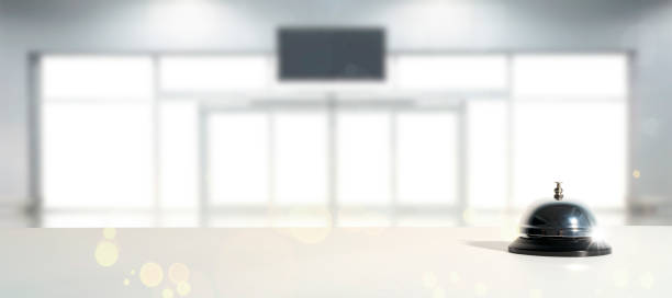 istock Hotel service bell on a table white glass and simulation hotel background. Concept hotel, travel, room 1344214296