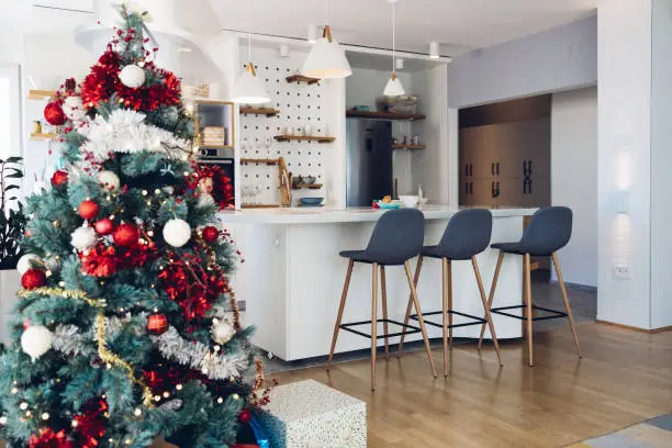 Beautifully decorated Christmas Tree in an Apartment's Living Room