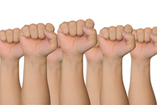 istock People raised fist air fighting for their rights with sunlight effect 1344215673