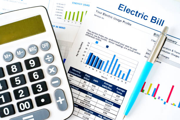 Electric bill statement and home energy consumption Home electricity expenses and bill statement document cost of living stock pictures, royalty-free photos & images