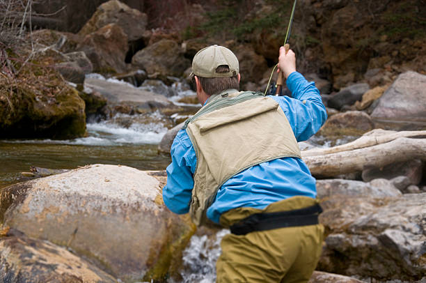 istock Man Stalks Trout Fly Fishing 134421744