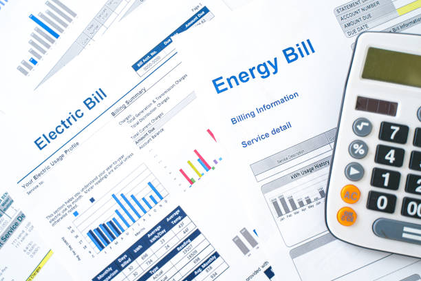 Electric bill statement and home energy consumption Home electricity expenses and bill statement document kilowatt stock pictures, royalty-free photos & images