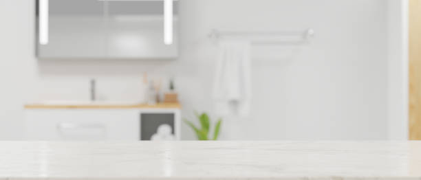 istock Copy space on marble tabletop for montage white blurred modern contemporary bright bathroom 1344217839