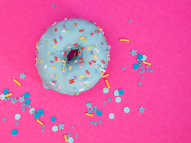 istock Red and blue cronuts on a pink background. 1344218119