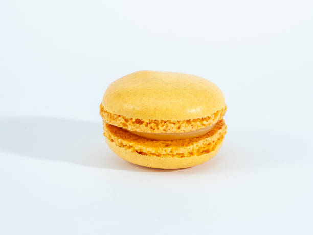 istock Sweet lemon macarons isolated on white background. 1344219373