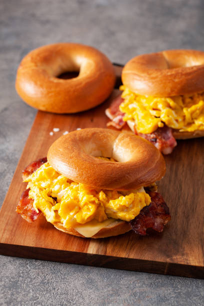 istock breakfast egg and bacon sandwich on bagel with cheese 1344221023