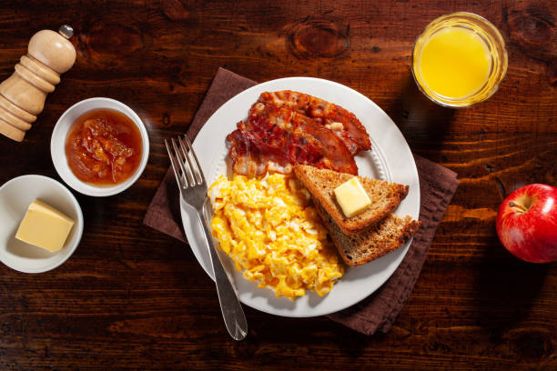 istock traditional scrambled egg breakfast with bacon and toast 1344221067