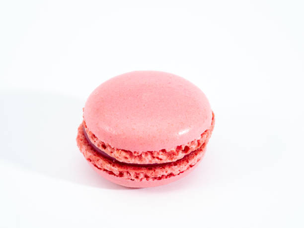 istock Sweet raspberries macarons isolated on white background. 1344221829