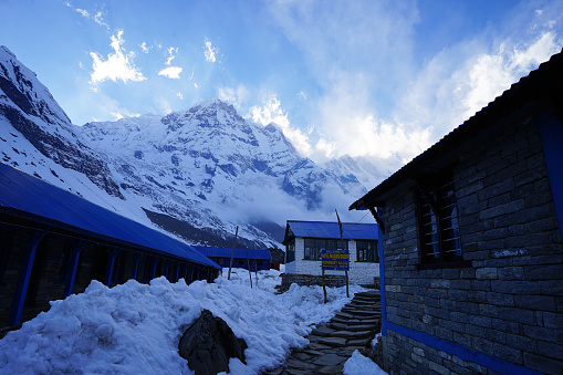 Exterior architecture of Nepal buildings with natural landscape view of snowcapped hill ridge