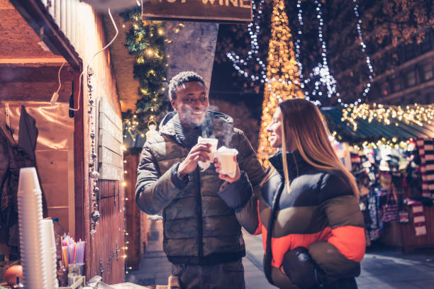 istock Couple in a Christmas market 1344223816