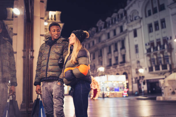 istock Couple in a Christmas window shopping 1344224015