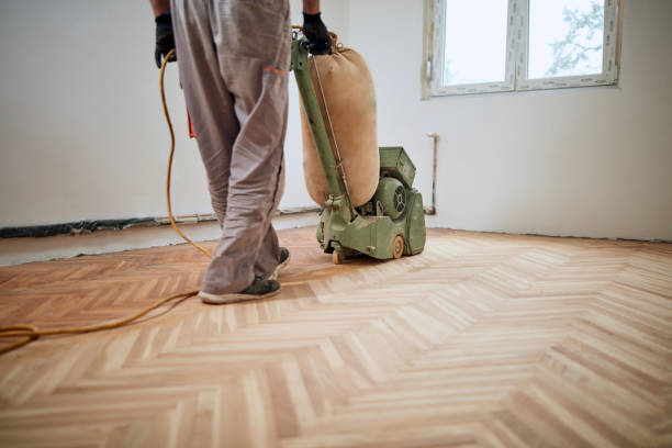 istock Repairman restoring parquet with a sanding machine. 1344231517