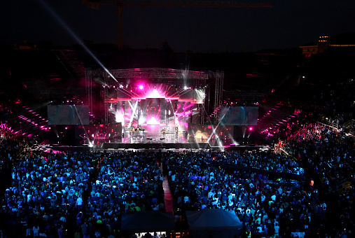 Verona, VR, Italy - June 5, 2017: Live concert inside the Ancient Roman Arena with many people and stage