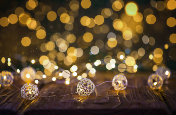 Rustic Wooden Table with Christmas Lights and Bokeh in the Background