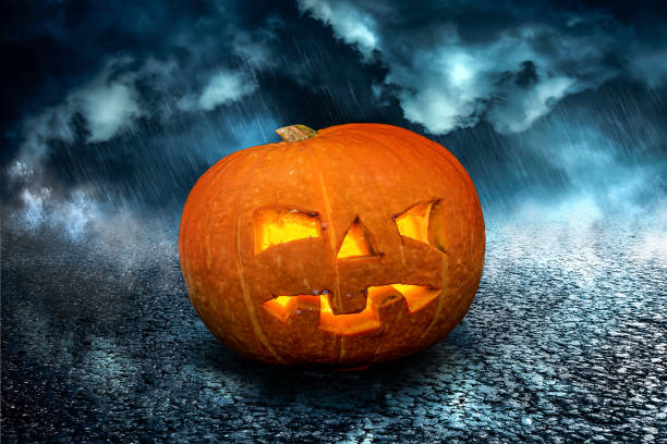 istock Halloween scary Night Pumpkin on dramatic dark creepy sky background. Halloween horror greeting card 1344234831
