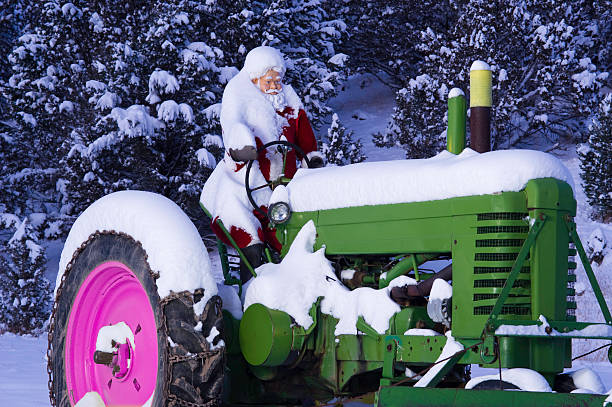 istock Santa Driving Tractor in WInter Snow 134423698