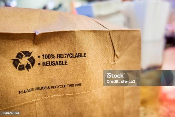 Brown Paper Bag That Is 100 Recyclable And Reusable On A Counter Stock Photo - Download Image Now