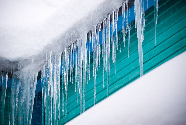 istock Icicles Hanging From Victorian Style Home in WInter While Snowing 134424068