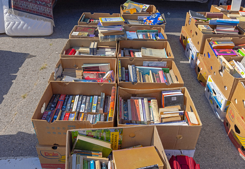 Belgrade, Serbia - September 11, 2021: Many Old Books in Boxes for Sale at Flea Market Sunny Day.