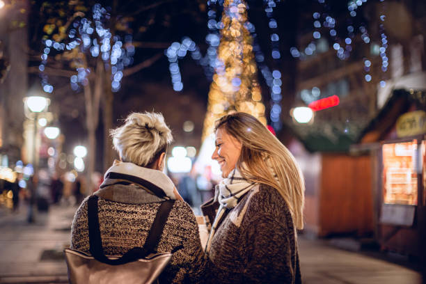 istock Lesbian couple on a Christmas market 1344241032