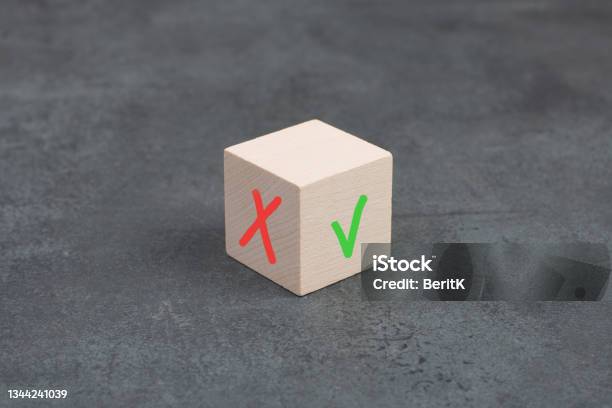Wooden Cube With A Checkmark And A Cross Desicion Making Choosing Between Options Stock Photo - Download Image Now