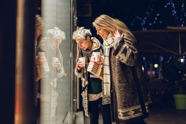 istock Lesbian couple, Christmas window shopping 1344241042