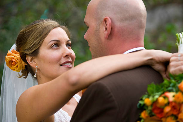 istock Bride and Groom Embrace on Wedding Day 134424181