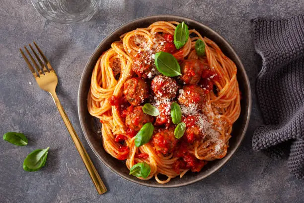 Photo of spaghetti with meatballs and tomato sauce, italian pasta