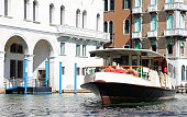 vaporetto the public transport of the island of venice in the grand canal with very few people due to the lockdown
