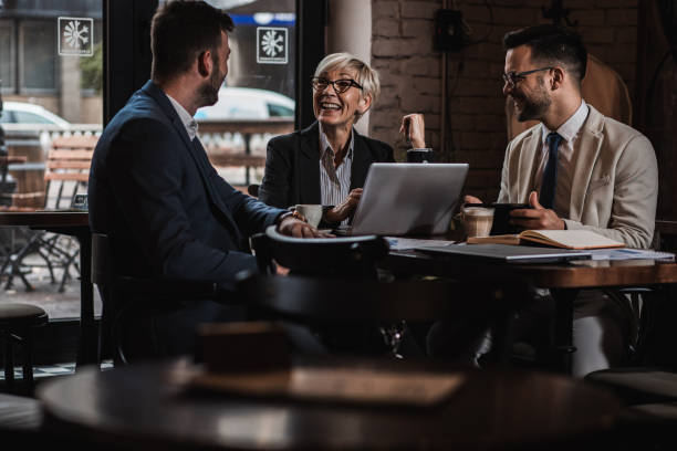 istock Business people holding a meeting at office cafeteria discussing about business plan. 1344242528