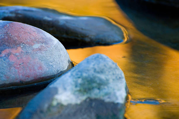 istock Rocks and Fall Color Reflections in Water 134424454