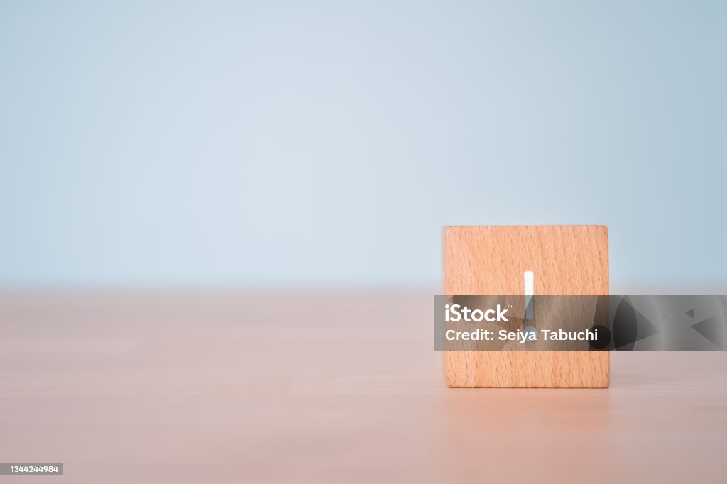 A wooden block with an exclamation mark. Alertness Stock Photo