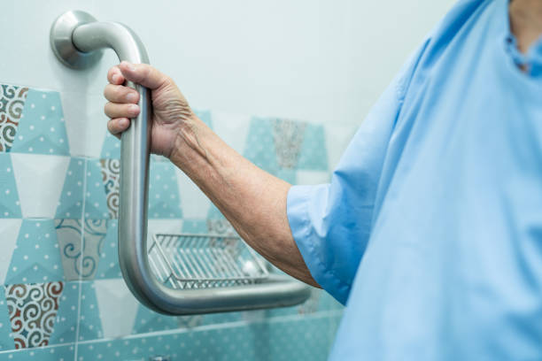 istock Asian senior or elderly old lady woman patient use slope walkway handle security with help support assistant in nursing hospital ward; healthy strong medical concept. 1344246260