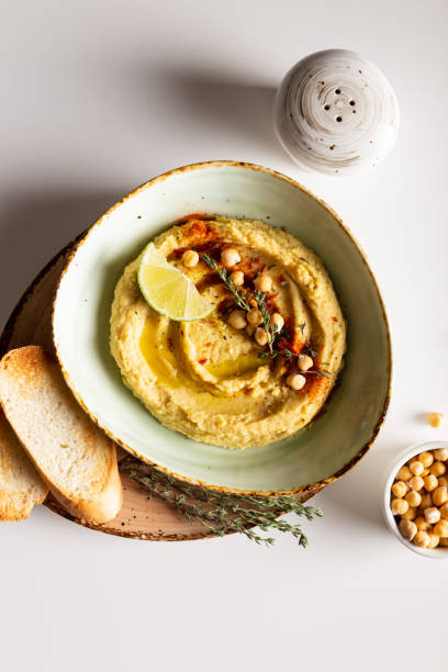 istock Classic hummus with spices and lime in a bowl 1344246676
