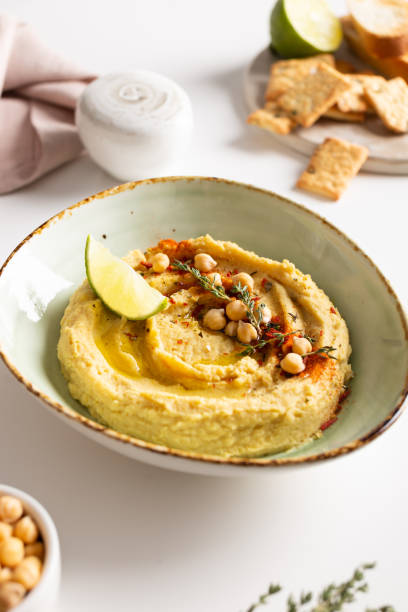 istock Classic hummus with spices and lime in a bowl 1344246681