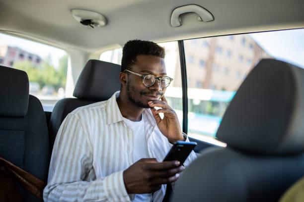 istock Young man checking his social media while traveling by car 1344248024