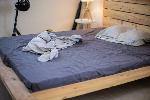 istock Empty messy bed in modern bedroom in apartment 1344249252