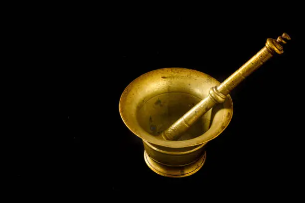September 2021.Close up of a copper mortar on black background. High quality photo