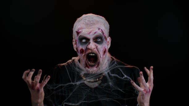 istock Aggressive Halloween zombie man asking reason of failure feeling bored, disappointed, irritation 1344252222