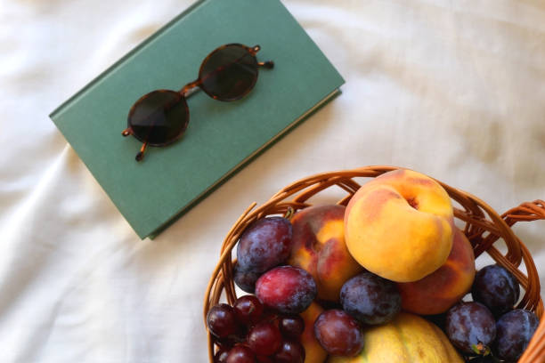 istock Picnic Basket, Book and Sunglasses 1344254270