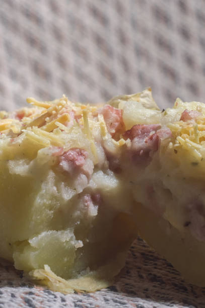 istock potato stuffed with cheese, sausage and ham 1344254711