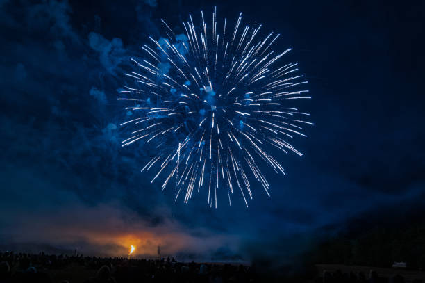 fuochi d'artificio al chiaro di luna - fireworks foto e immagini stock