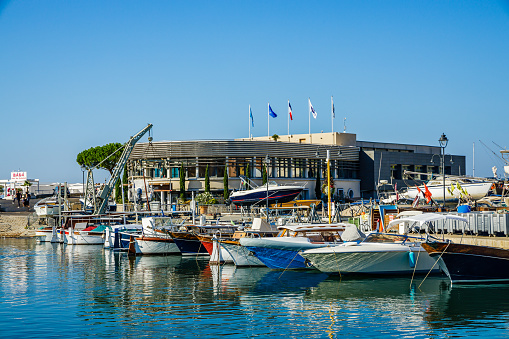 Boats of the Port of Cassis and building of the tourist office in Provence, France