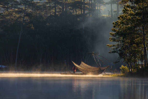 istock Fisherman in Tuyen Lam lake 1344258235