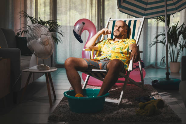 istock Bored man spending summer vacations at home 1344258276