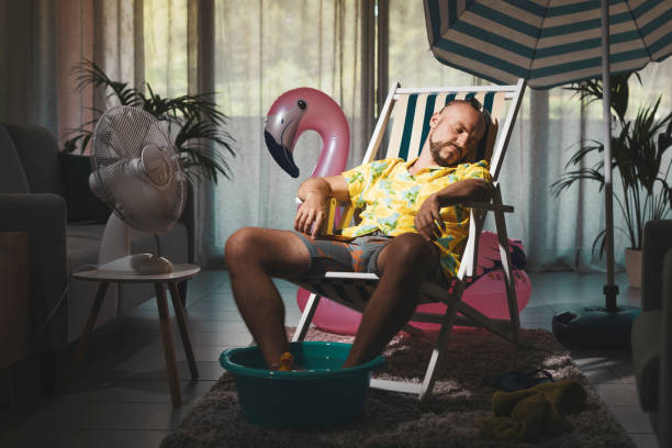 istock Bored man spending summer vacations at home 1344258400