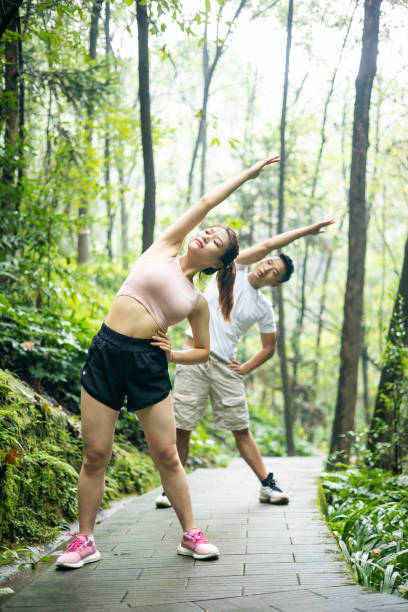 istock Young couple sports training in park 1344259359