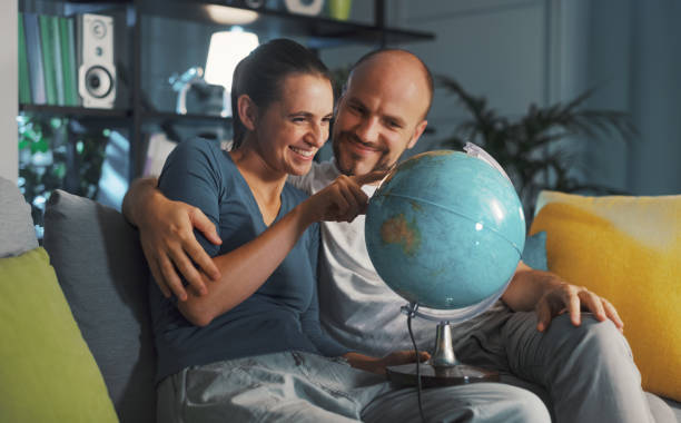 istock Happy couple picking a destination for their next travel 1344264660