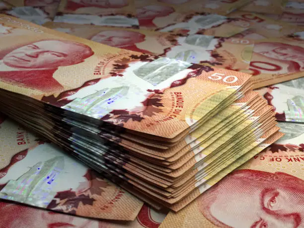 Photo of Canadian banknotes. Canadiandollar bills. 50 CAD dollars. Business, finance background.